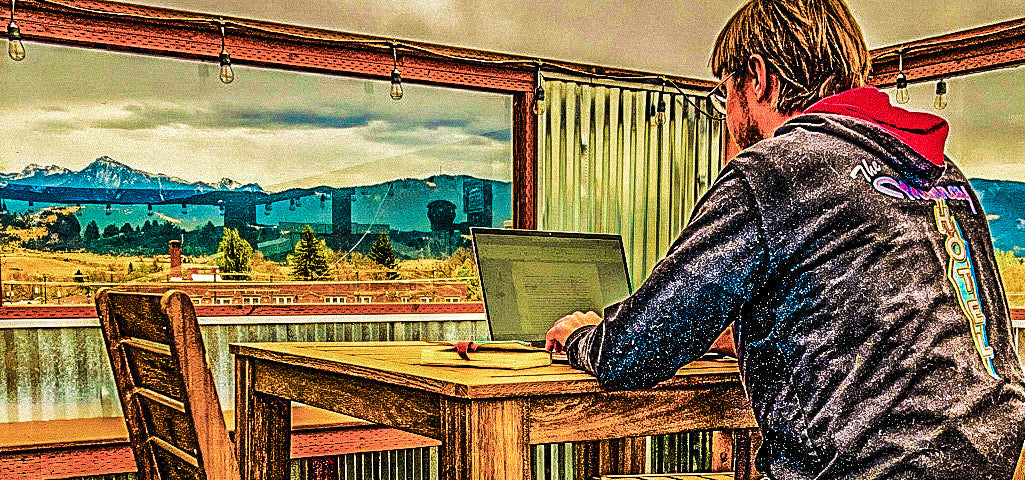 James Bonner Writing in Livingston, Montana on the rooftop patio of the Murray Hotel.